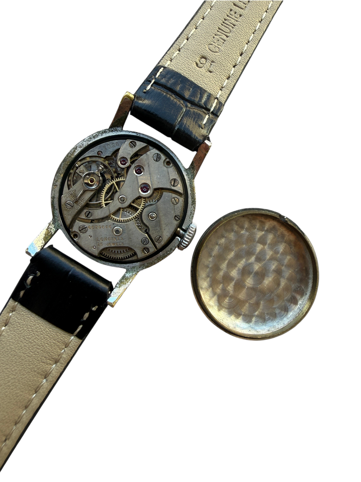 Montre vintage vinqo.store des années 30 avec mouvement mécanique Longines cal. 1062 apparent et bracelet cuir noir