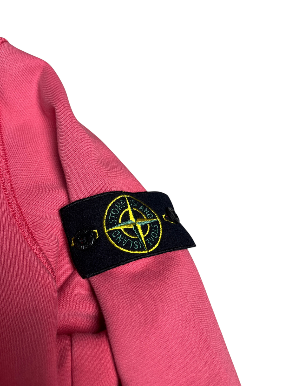 Sweat-shirt rose vinqo.store avec écusson Stone Island emblématique sur la manche