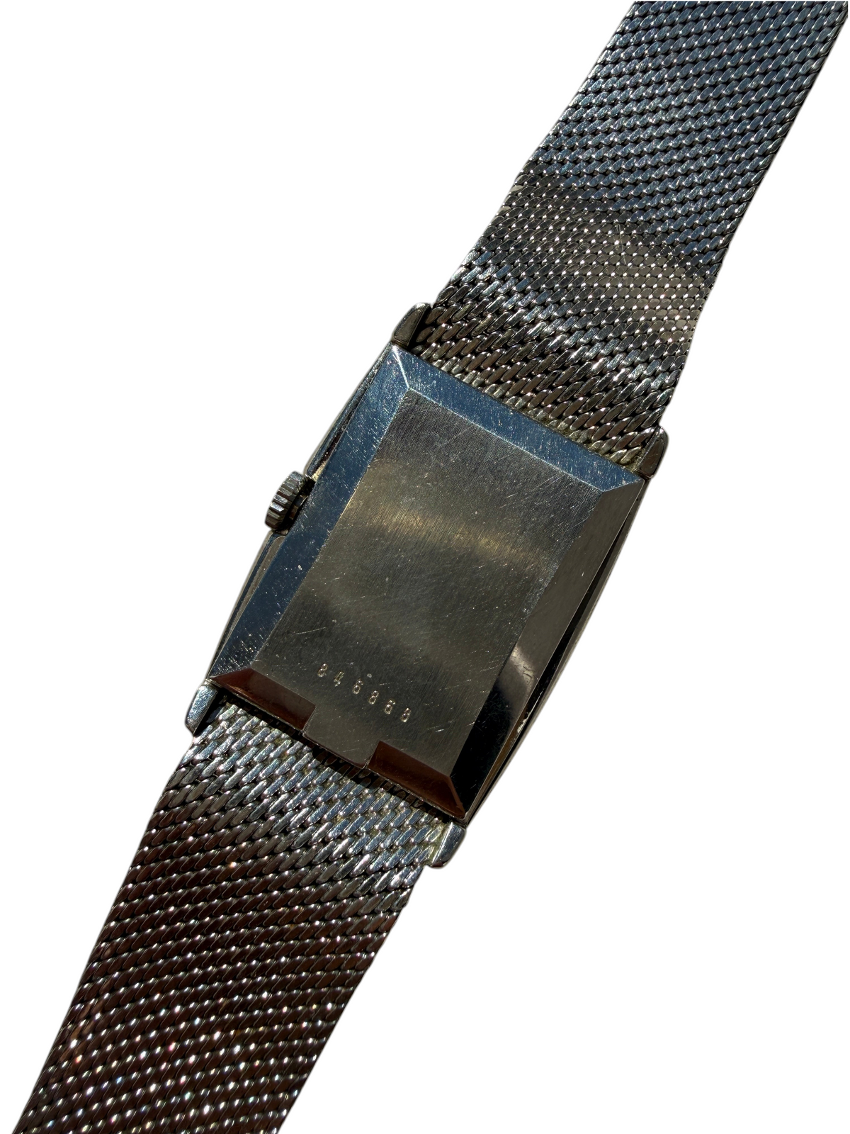 Dos du boîtier d'une montre vintage vinqo.store Juvenia Tank avec bracelet en maille milanaise en acier