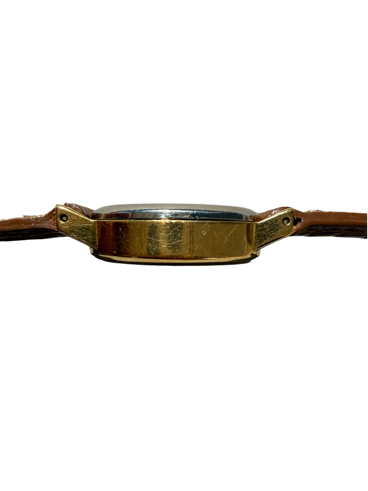 Vue de profil du boîtier plaqué or d'une montre vintage pour femmes vinqo.store avec bracelet en cuir marron