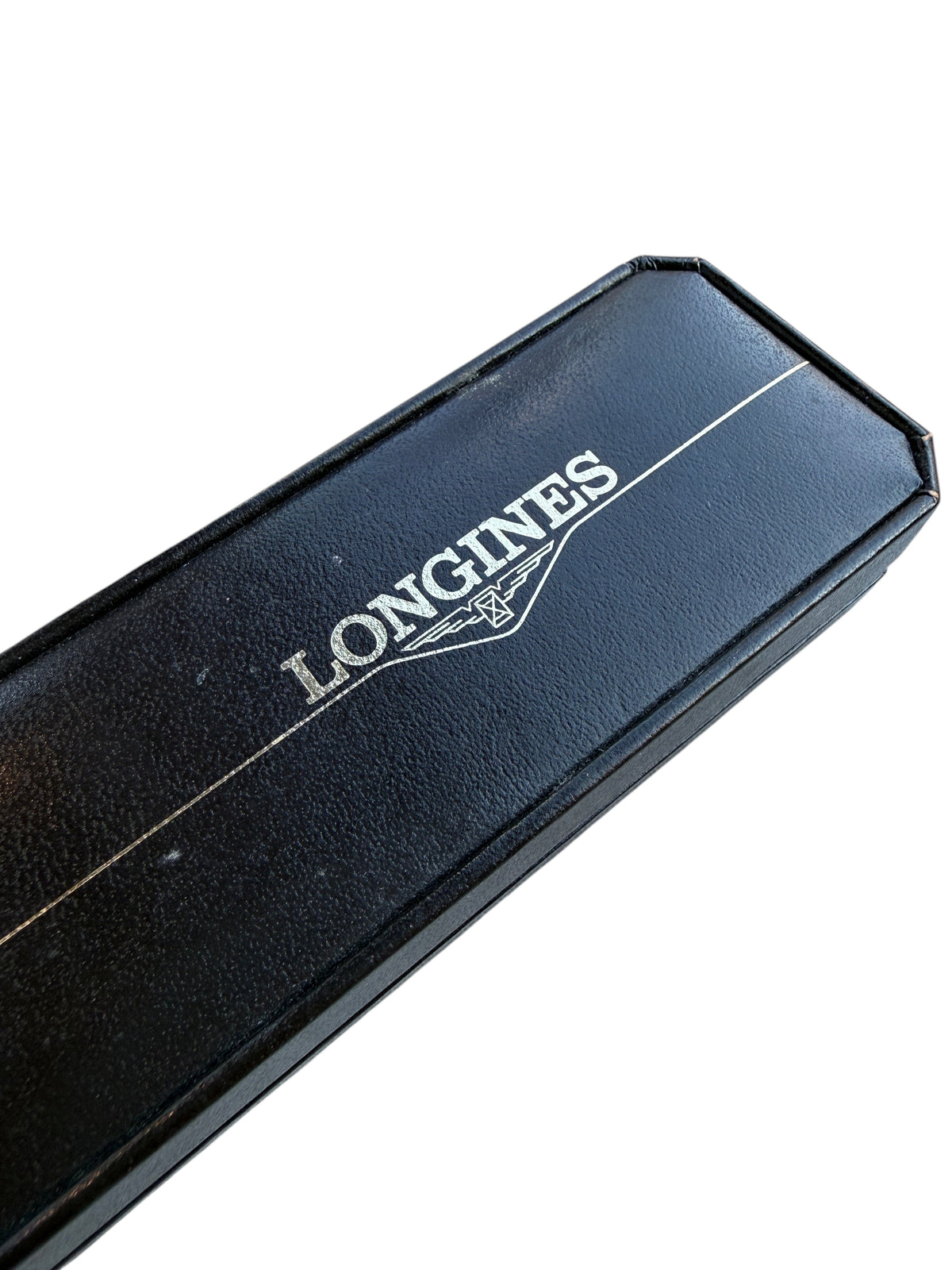 Boîte de montre vintage noire avec logo Longines argenté, proposée par vinqo.store