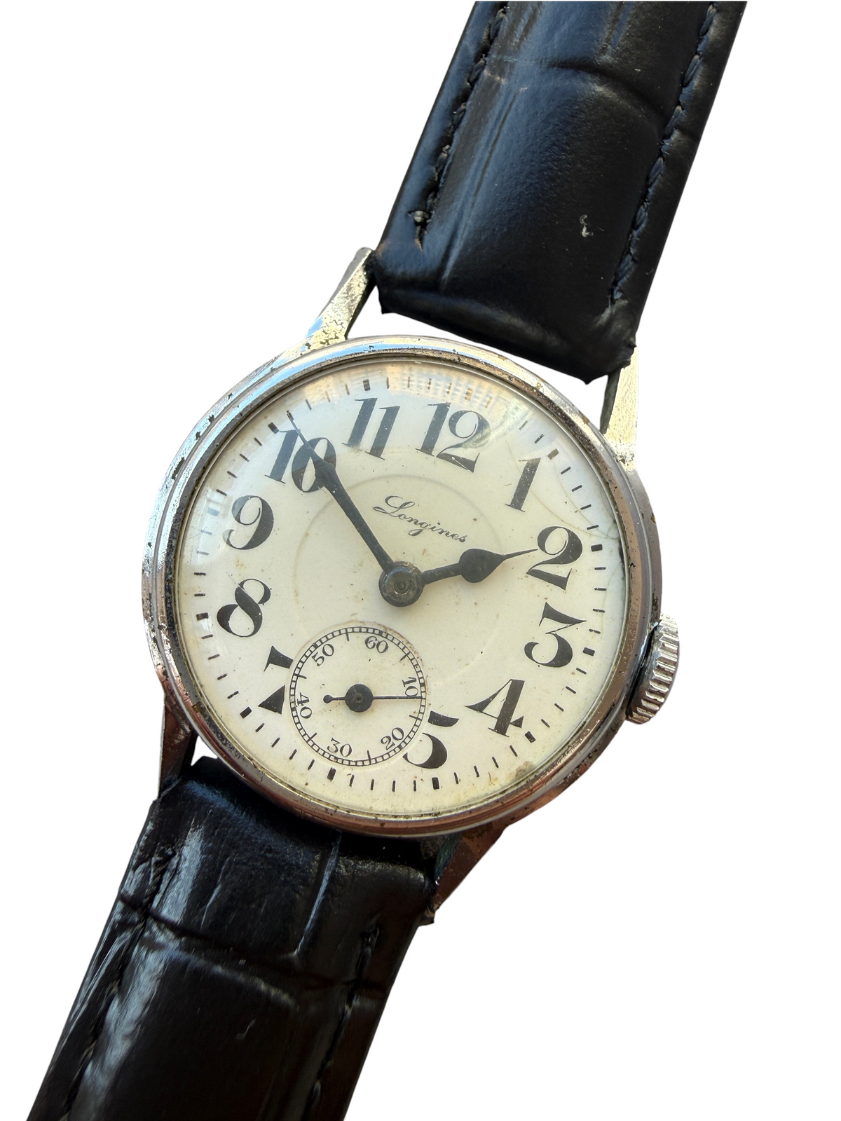 Montre vintage vinqo.store Longines des années 30 avec cadran crème, boîtier chromé et bracelet en cuir noir neuf.