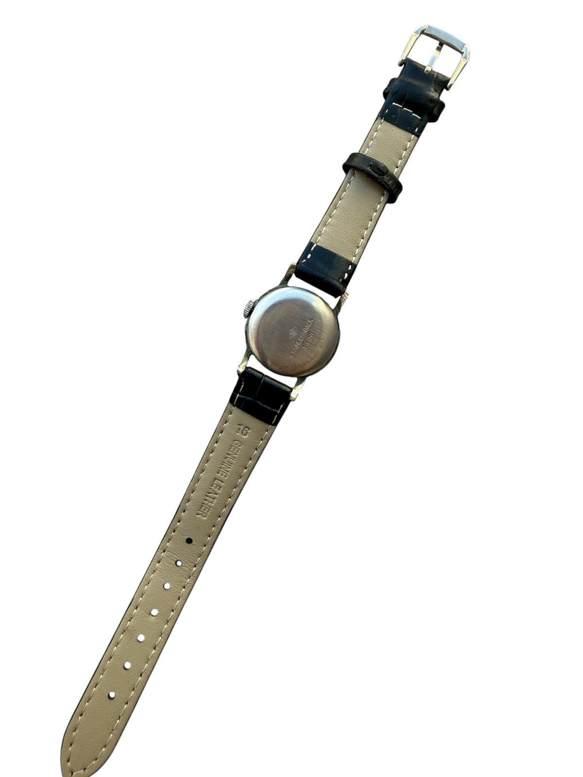 Dos du boîtier en acier d'une montre vintage vinqo.store Longines des années 30 avec bracelet en cuir noir neuf