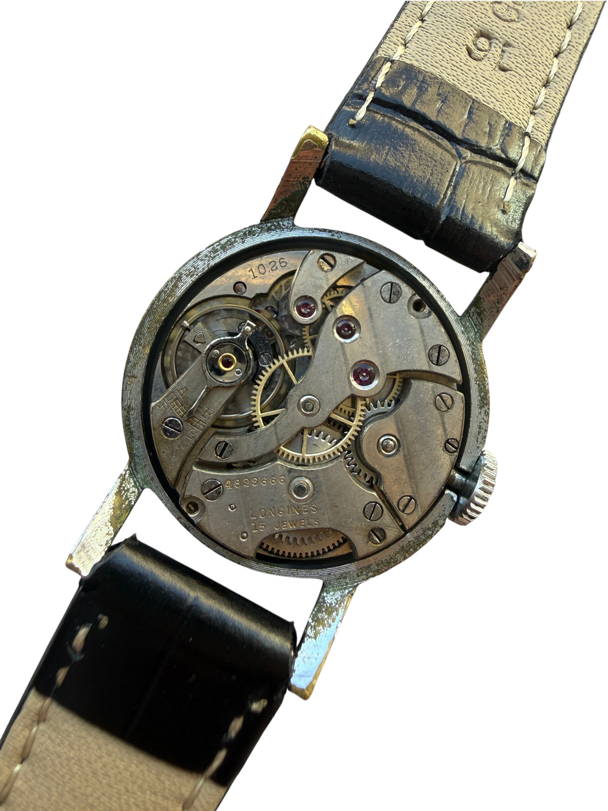 Mouvement mécanique Longines calibre 1062 visible au dos d'une montre vintage vinqo.store avec bracelet en cuir noir